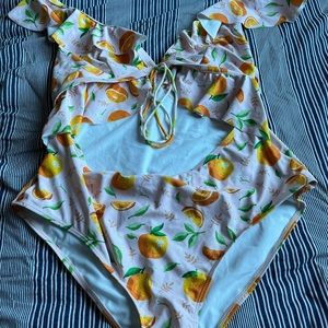 Cute ruffle cut out sheik one piece